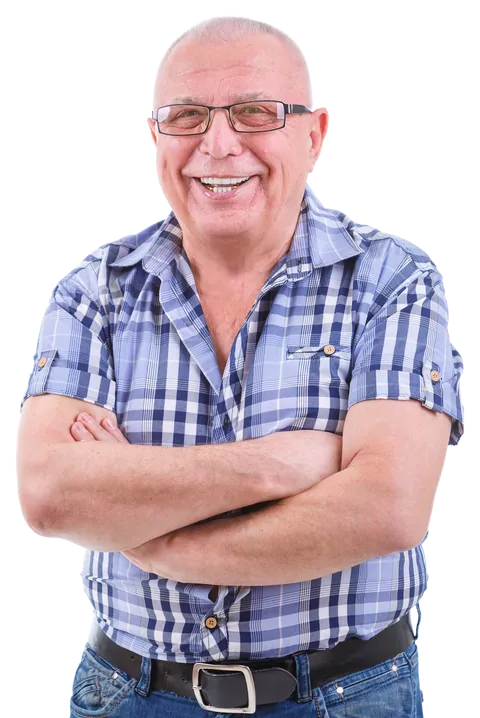 A smiling older man with his arms crossed