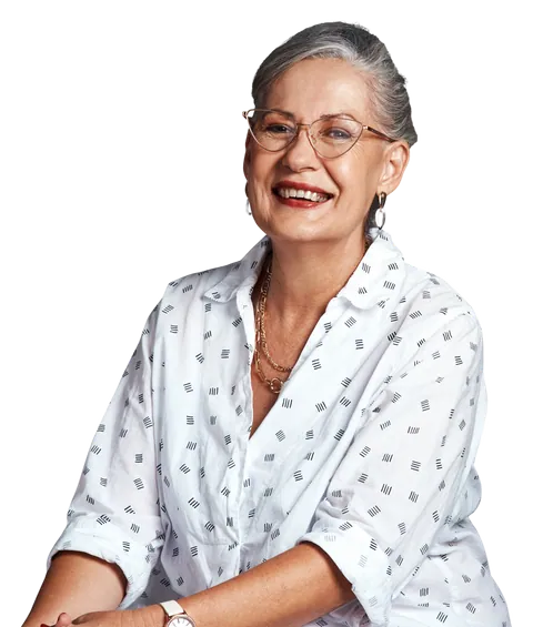 A smiling older woman with glasses