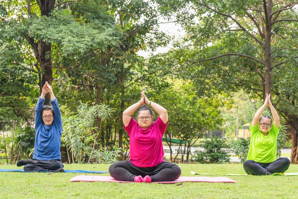 A group doing yoga together outdoors