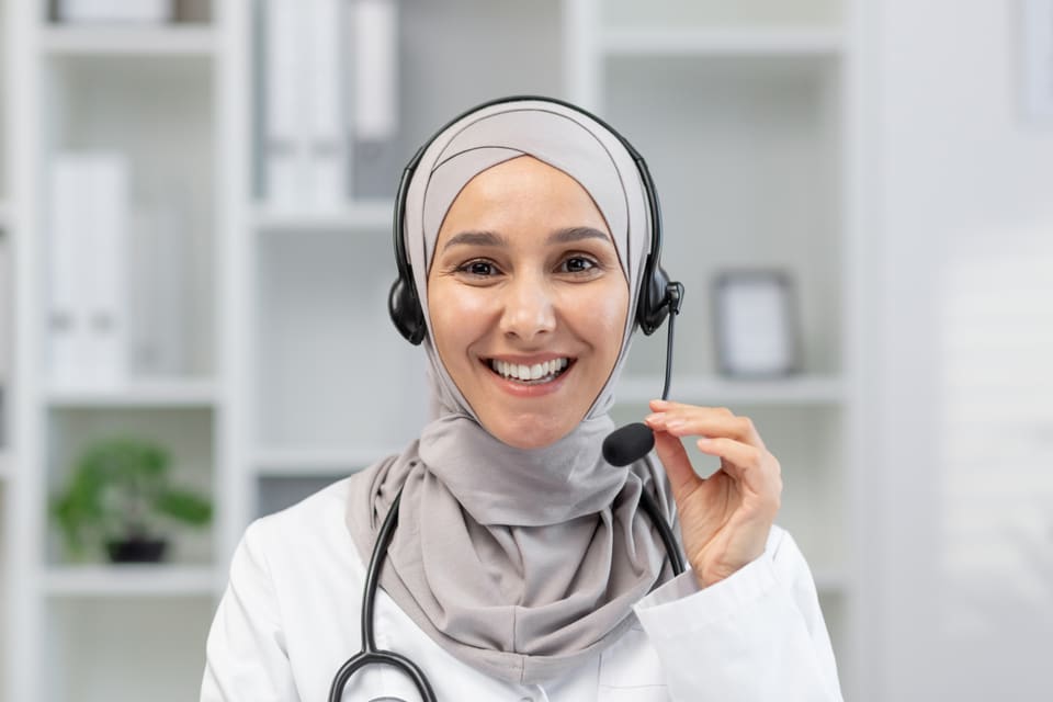 A smiling coordinator on a headset