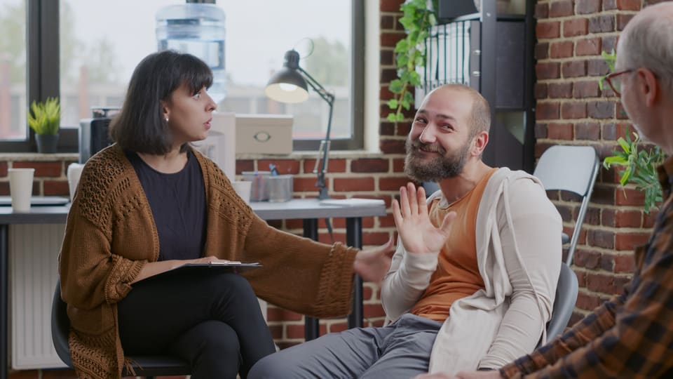 A manager interviewing a candidate in an office