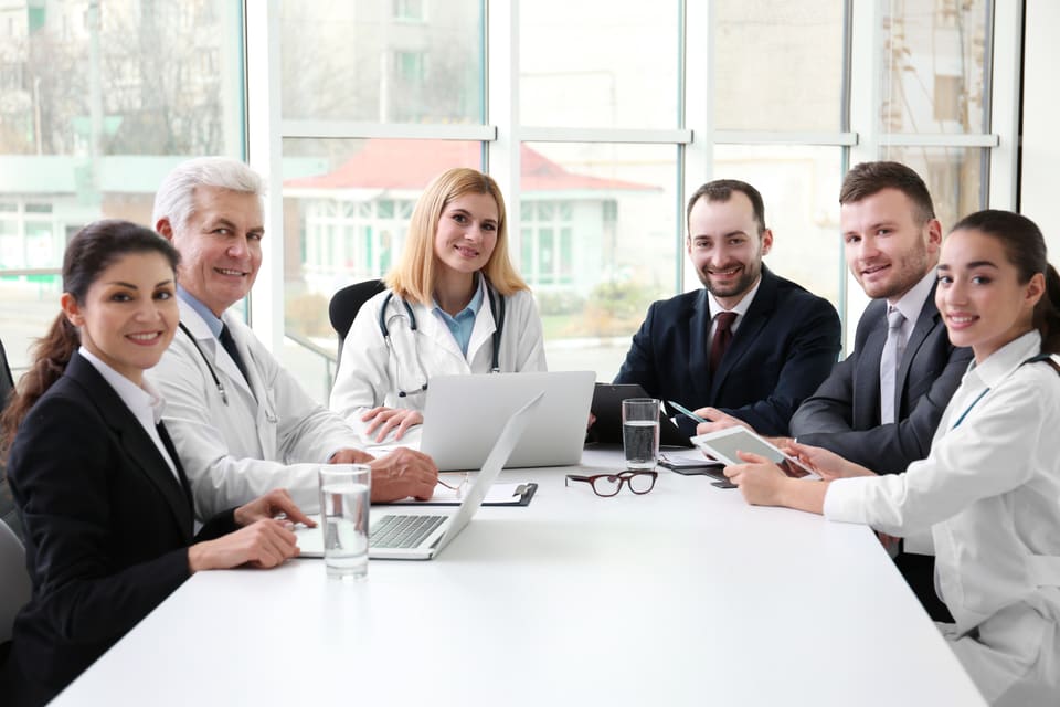 A meeting around a boardroom table