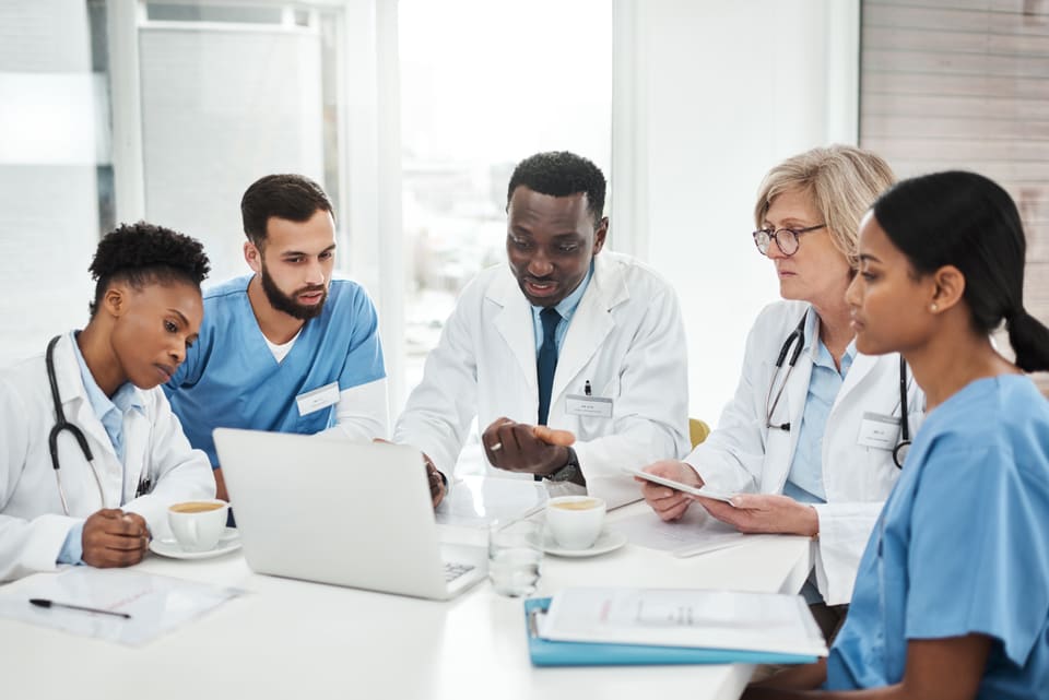 A care team meeting around a table