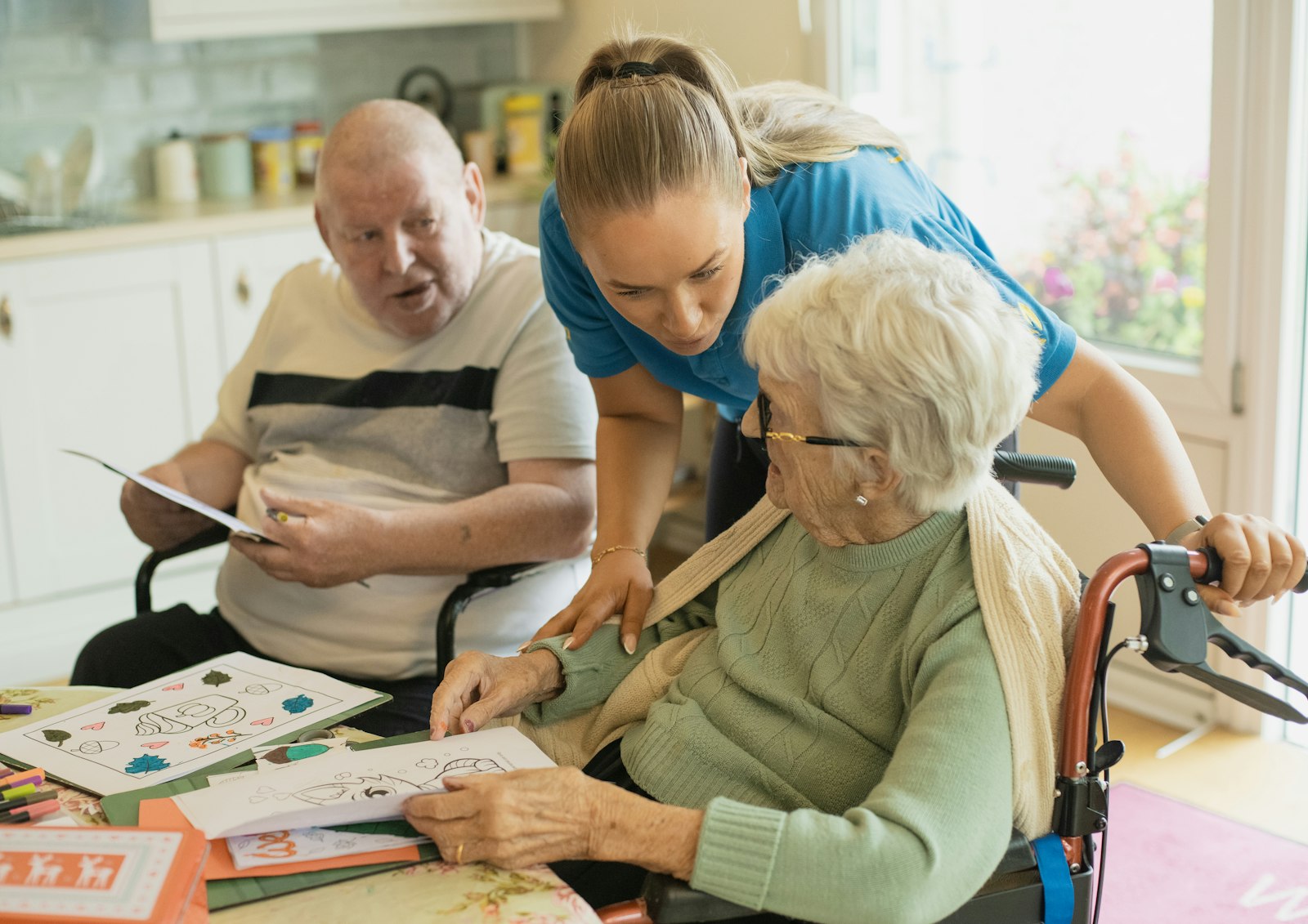 A carer doing an activity with an older person