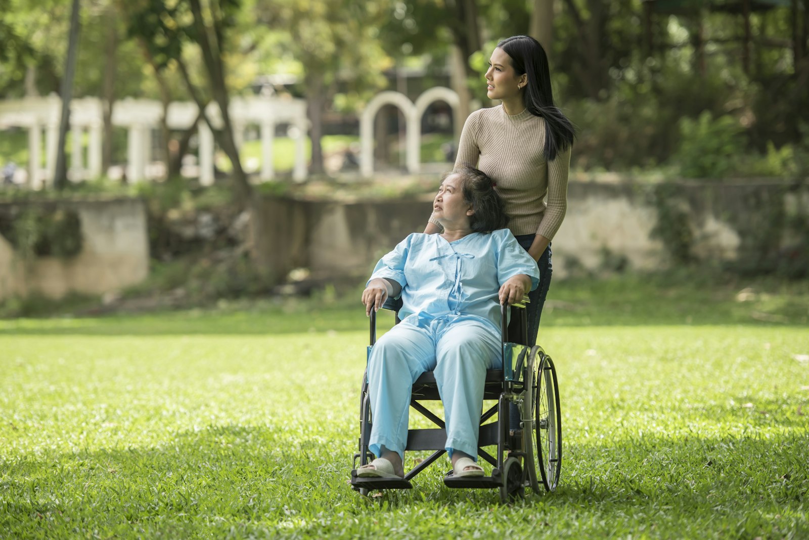 A support worker and participant together outdoors